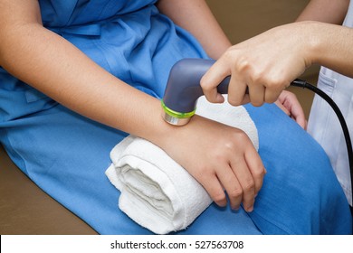 Ultrasound In Physical Therapy - Therapist Using Ultrasound To Treat Patient's Hand