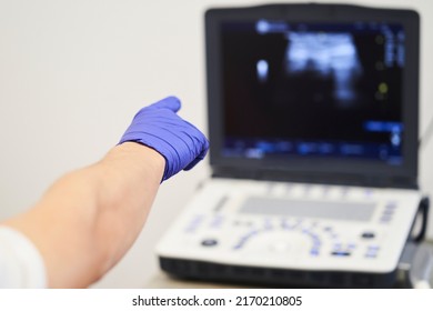 Ultrasound Scan At The Fertility Clinic. Doctor Pointing At The Screen