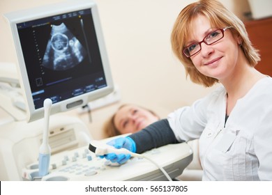 Ultrasound scan. Pregnancy. Gynecologist checking fetal life with scanner.