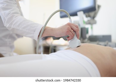 Ultrasound scanner device in hand of professional doctor examining his patient