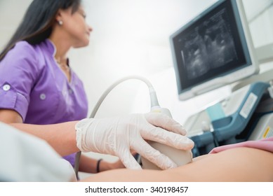 Ultrasound scanner in the hands of a doctor. Diagnostics. Sonography.