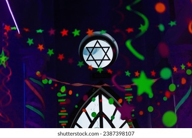 Ultraviolet decoration for celebration Purim Jewish holiday. Colored Purim festival decoration with David star in center
