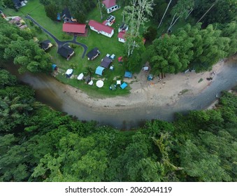 ULU BERNAM, MALAYSIA. MARCH 2021 - Drone Or Aerial View Of A Camp Site By A River Side Passing Through Forest