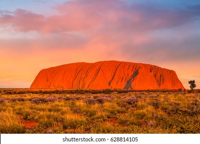 ULURU, AUSTRALIA - CIRCA AUGUST 2016: Uluru at sunset under colorful clouds,Uluru-Kata Tjuta National Park, Northern Territory, Australia