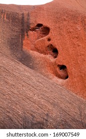 Uluru - Ayers Rock. Aboriginal Sacred Place. UNESO World Heritage. Red Sandstone Rock Closeup With Day Changing Color Painting.