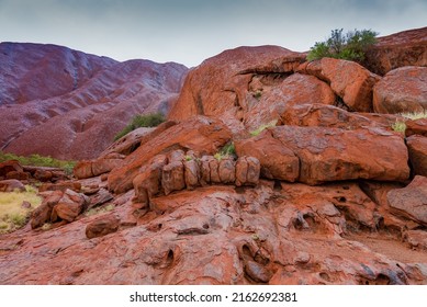 Uluru - Ayers Rock. Aboriginal Sacred Place. UNESO World Heritage. Red Sandstone Rock Closeup Of Caves.