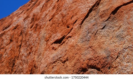 Uluru Kata Tjuta National Park, Australia - 10 27 2011: Close Up Of The Red Stone Of Uluru (Ayers Rock), A Sacred Place For The Aborigines