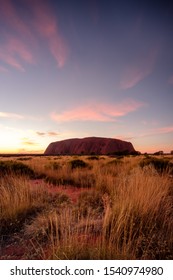 Uluru, Northern Territory / Australia - May 18 2018: Sunrise At Uluru With Colourful Sky And Desert