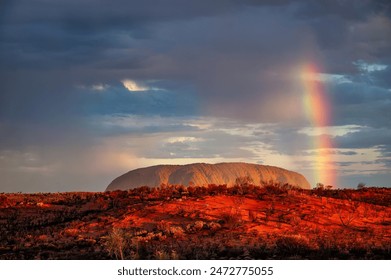 Uluru-Kata Tjuta National Park, Northern Territory, Australia: Rare rainbow over Uluru, Australia's famous outback monolith. - Powered by Shutterstock