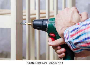 Ulyanovsk, Russia, November, 06, 2021: Assembly Of A Crib With A Bosch Screwdriver