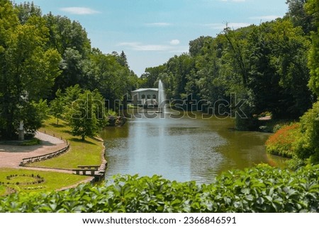 Uman, Ukraine - June 24, 2023: Sofiyivka National Dendrological Park in summer. View of the fountain and arch