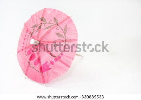 Umbrella for cocktails on a white background.