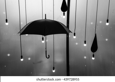 Umbrella With Fall Rain And Light. Idea Concept. Black And White