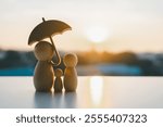 Umbrella icon and family model, Security protection and health insurance. The concept of family home, protection, health care day, car insurance.	