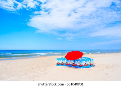 Umbrella And Windbreaker On Leba Beach, Baltic Sea, Poland