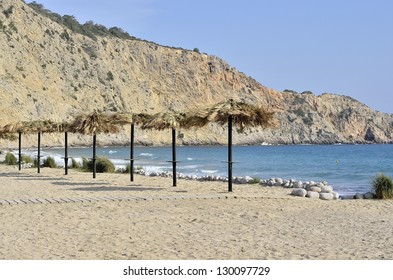 Umbrellas on a beach in Ibiza, Balearic - Shutterstock ID 130097729