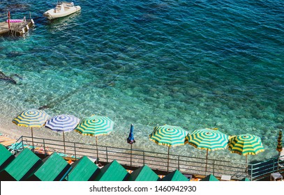 Umbrellas On The Beach. Island Of Capri In Italy