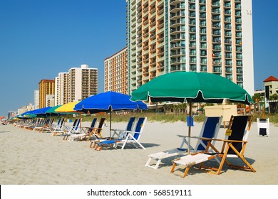 Umbrellas In A Row Along The Grand Strand Of Myrtle Beach