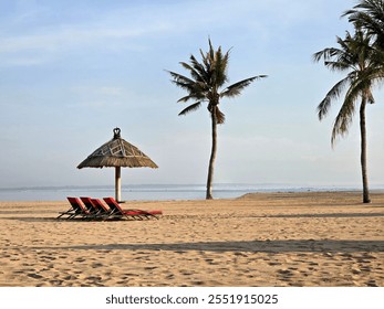 Umbrellas and sun loungers on the beach. straw parasol, summer vacation concept - Powered by Shutterstock