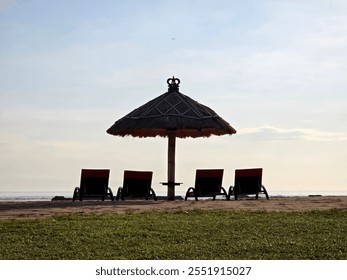 Umbrellas and sun loungers on the beach. straw parasol, summer vacation concept - Powered by Shutterstock