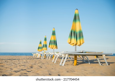 Umbrellas And Sunbeds