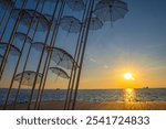 The Umbrellas of Zongolopoulos at Mediterranean Sunset - Thessaloniki Waterfront, Greece