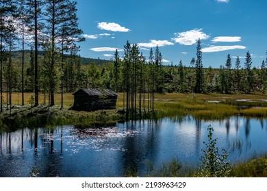Umea, Sweden A small wooden cabin on a swamp. - Shutterstock ID 2193963429