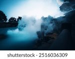 Umi Jigoku (Sea Hell), a hot spring in Beppu Onsen, Oita, Japan, known for its boiling cyan waters and thick white steam. The name translates to 