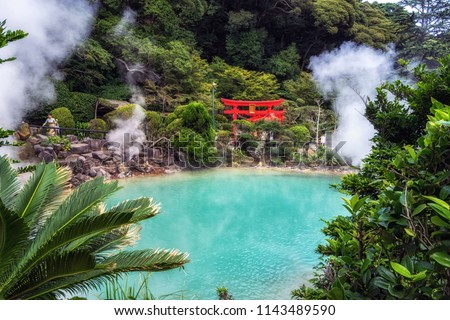 umi jigoku or sea hell taken in beppu with steamy hot springs geyser steaming off the cobalt water. Red torii gates nearby the geyser. Taken in Beppu, Japan Zdjęcia stock © 
