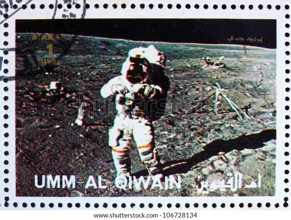 UMM AL-QUWAIN - CIRCA 1972: a stamp printed in\
the Umm al-Quwain shows Astronaut walks on the Surface of the Moon,\
Moon-landing, Apollo, circa\
1972