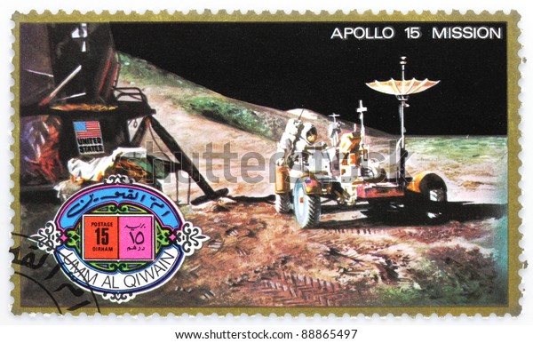 UMM AL-QUWAIN - CIRCA 1975: A\
stamp printed in Umm al-Quwain shows astronaut David Scott on the\
moon with LRV Rover from spaceship Apollo 15, circa\
1975.