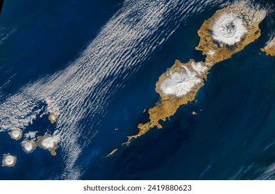 Umnak Island. Landsat caught a rare glimpse of the thirdlargest Aleutian Island. Elements of this image furnished by NASA. - Powered by Shutterstock