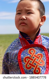 Umnugovi, Mongolia - 07 17 15: Adorable Mongolian Child In Colourful Mongolian National Dress Outdoors In The Gobi Desert Of Mongolia