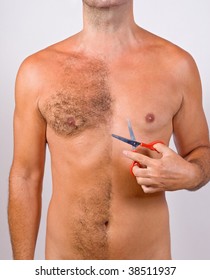 Un Shaved Man With Scissors. Torso Naked Male Body In The Process Of Shaving. Trimming Body Hair.