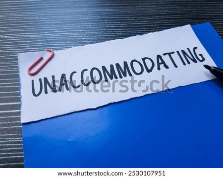 Unaccommodating writting on table background.