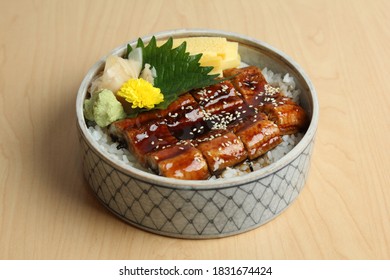 Unadon (eel bowl) is a dish originating in Japan. It consists of a donburi type large bowl filled with steamed white rice, and topped with fillets of eel (unagi) grilled in a style known as kabayaki.