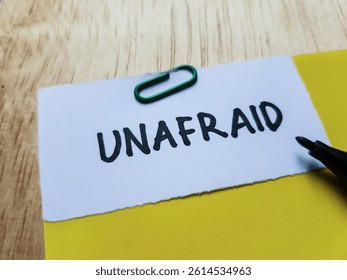 Unafraid writting on table background.