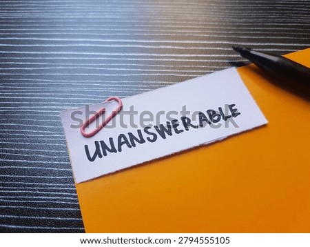 Unanswerable writting on table background. 