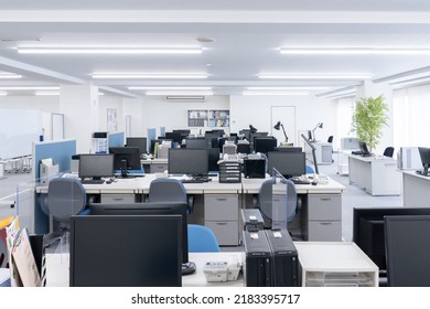 Unattended office with desks and computers - Shutterstock ID 2183395717