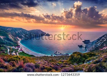 Unbelievable summer view of Petani Beach. Majestic sunset on Cephalonia Island, Greece, Europe. Beautiful evening seascape of Mediterranen Sea. Fantastic outdoor scene of Ionian Islands.
