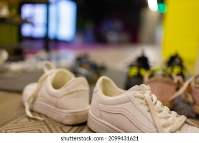 Unbranded Kids Shoes And Wellies On Shelves.