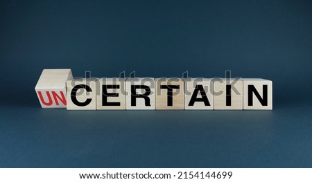 Uncertain or Certain. The cubes form the words Uncertain or Certain. Concept in business and lifestyle in decision making