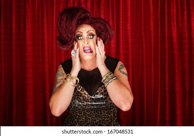 Uncertain Drag Queen With Hands On Face