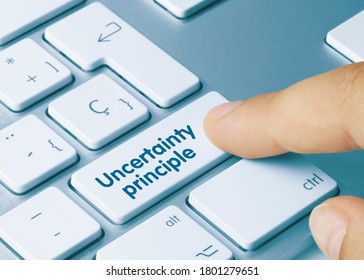 Uncertainty Principle Written On Blue Key Of Metallic Keyboard. Finger Pressing Key.