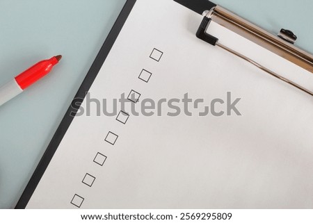 Unchecked checklist boxes close up with red marker