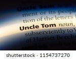 uncle tom word in a dictionary. uncle tom concept.