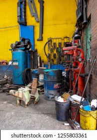 Unclean And Messy Corner Inside An Auto Repair Workshop Somewere In The City Of Bogota, Colombia.