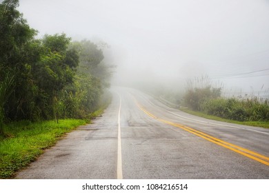 Unclear Road Landscape And White Mist Background.