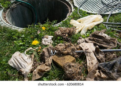 Unclogging Septic System. Cleaning And Unblocking Drain Full Of Disposable Wipes And Other Non Biodegradable Items.