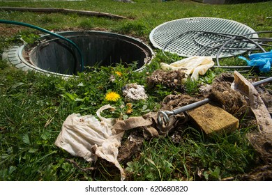 Unclogging Septic System. Cleaning And Unblocking Drain Full Of Disposable Wipes And Other Non Biodegradable Items.